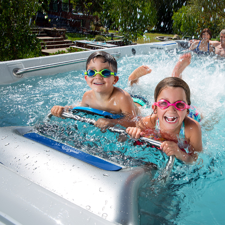 Kids Using Swim Machine On Endless Pools Swim Spa
