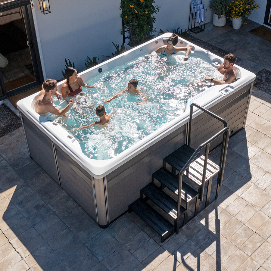 Family and Friends in an Endless Pools R220 Swim Spa