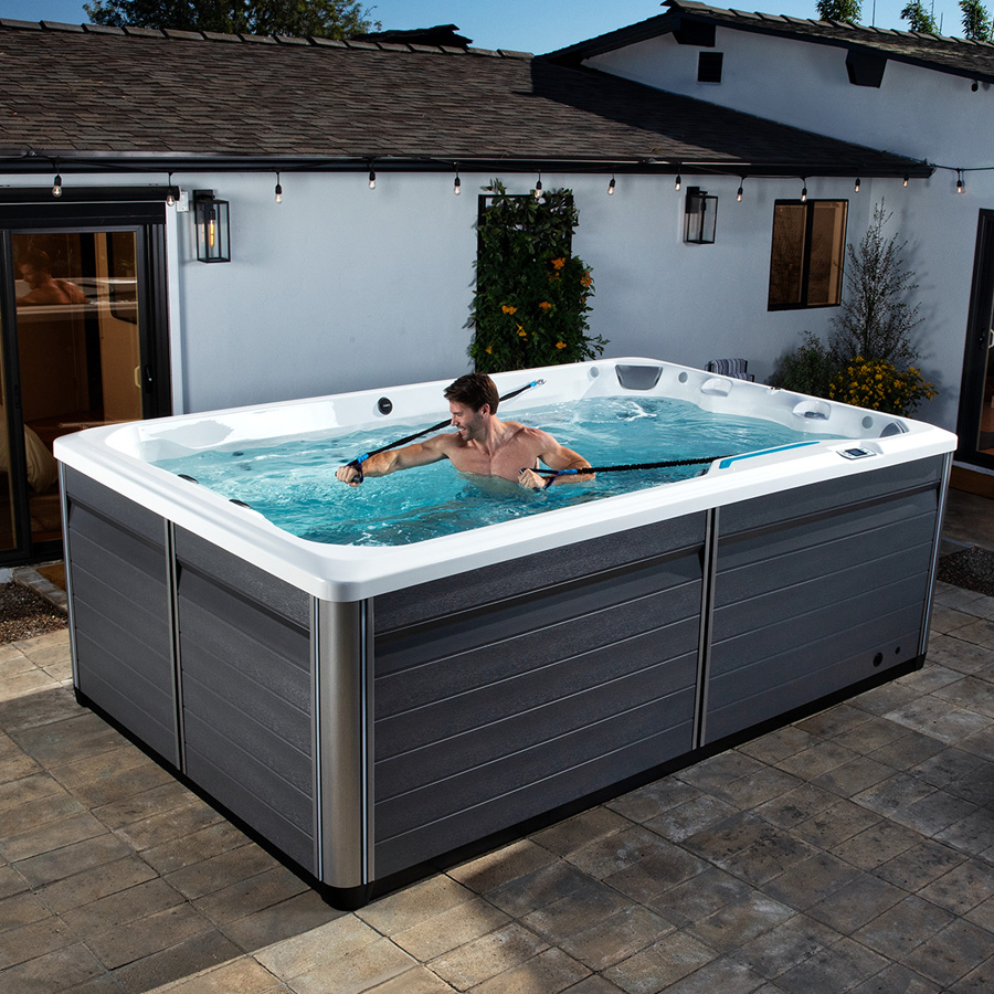 Man using Exercise bands in Endless Pools R200 Swim Spa