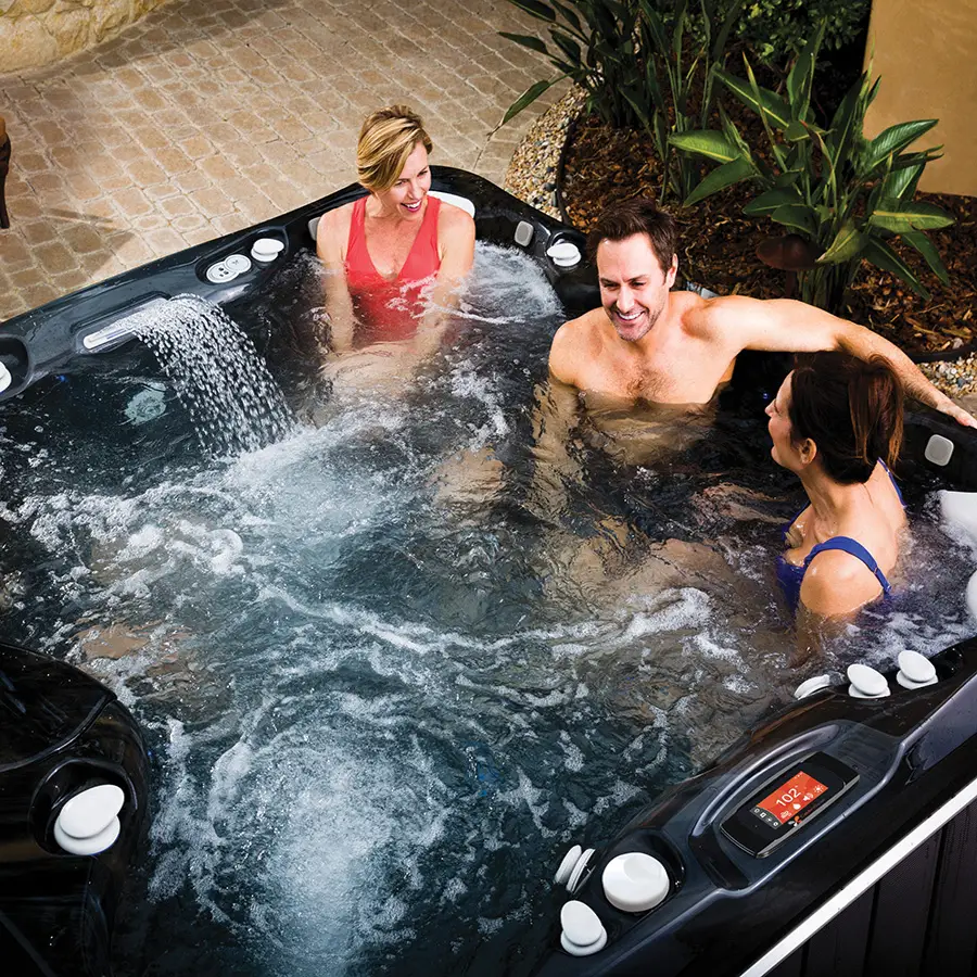 Image of Group of friends using Caldera Utopia Niagara Hot Tub showing water feature