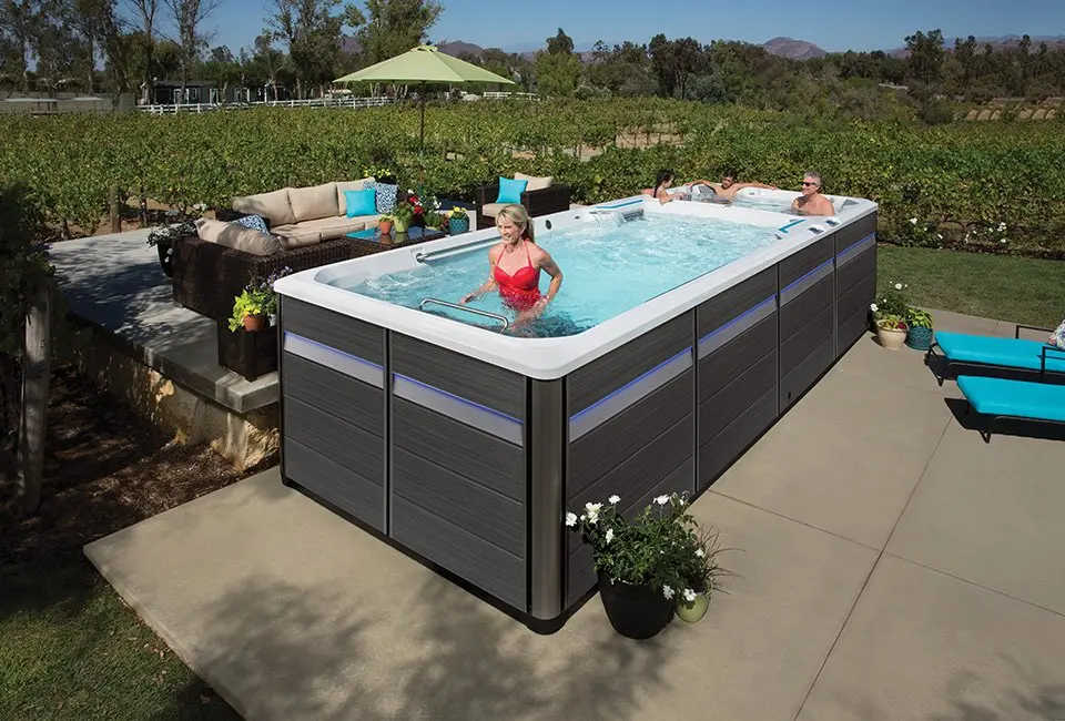 Person relaxing in a hot tub after work, steam rising
