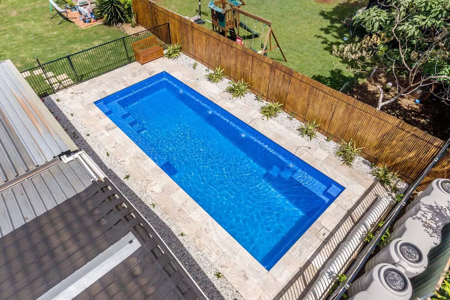 Large inground pool with stone surround