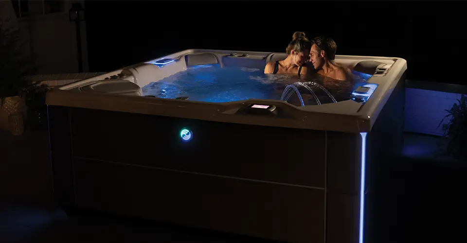 Person relaxing in a hot tub after work, steam rising
