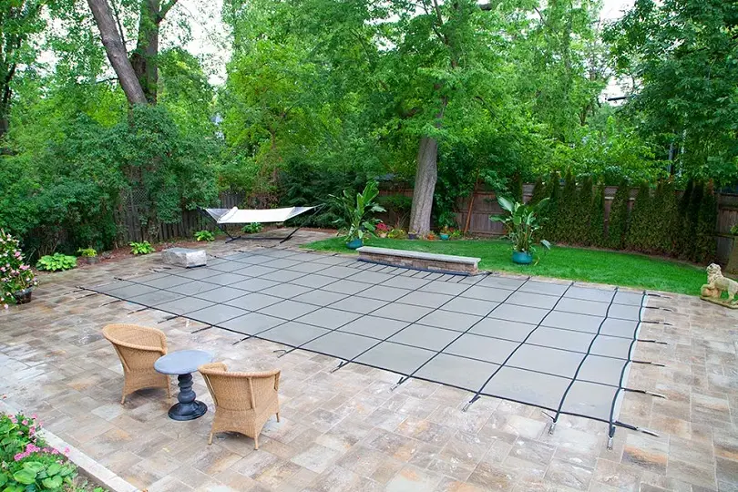 Inground Pool safety cover in small backyard