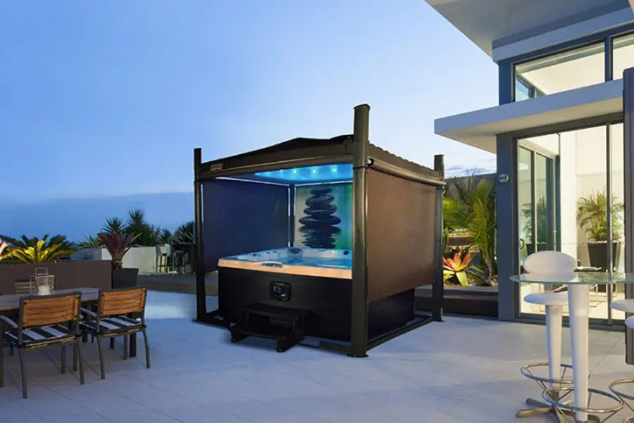 A Covana automated spa cover system open over a hot tub