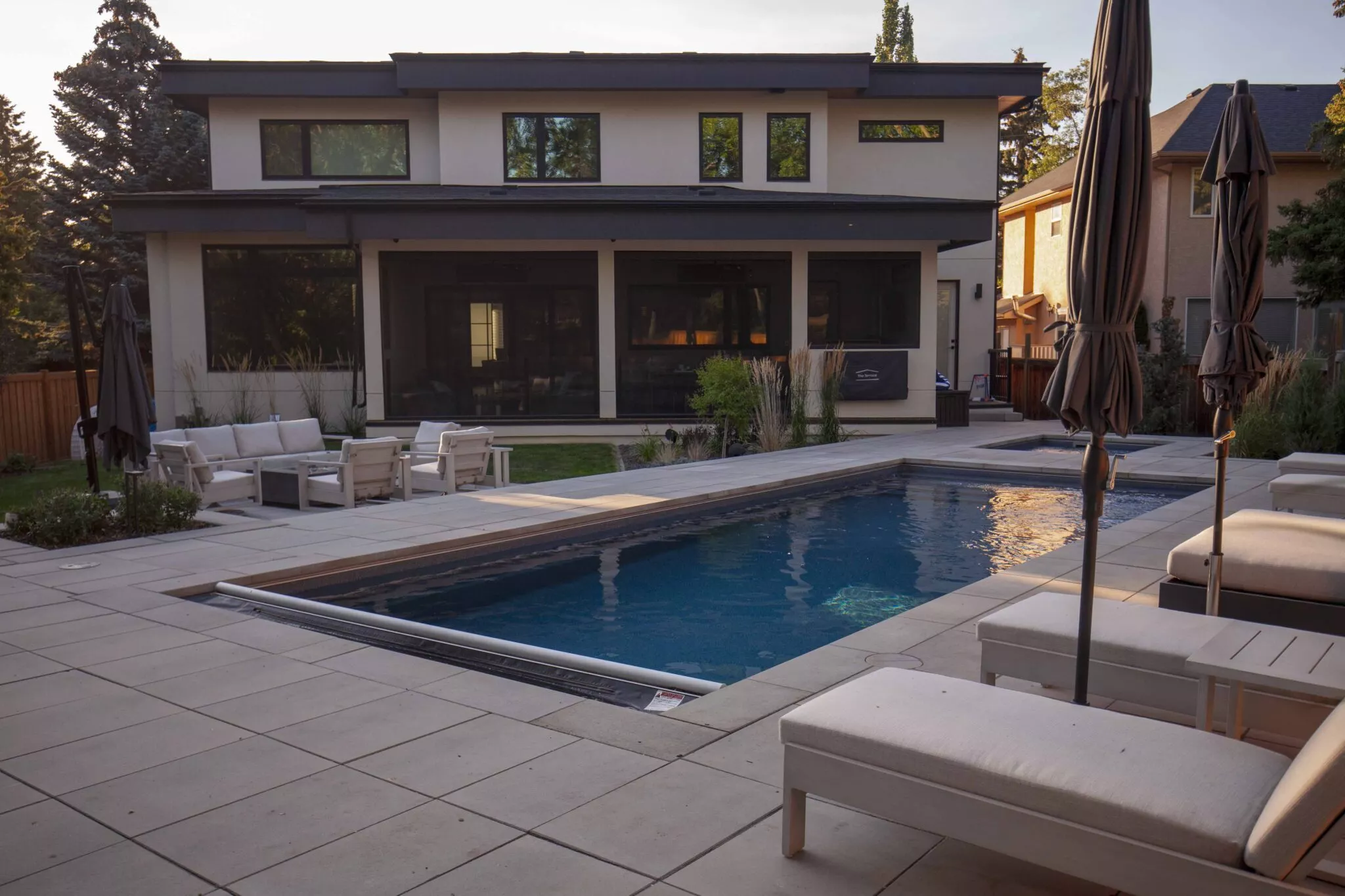 Pool with water feature at night