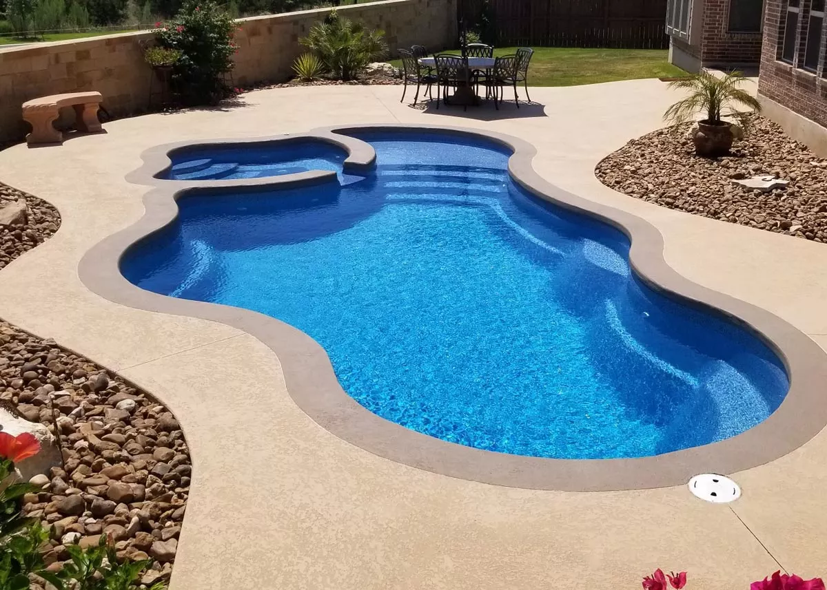 Pool with water feature at night