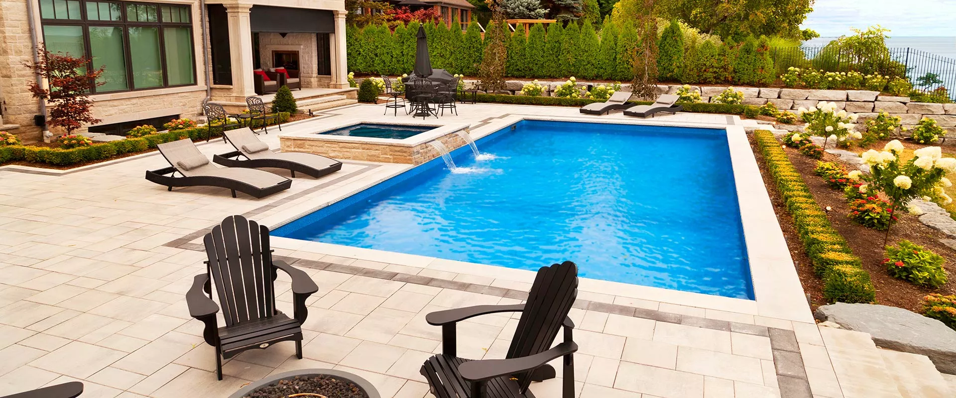 Pool with water feature at night