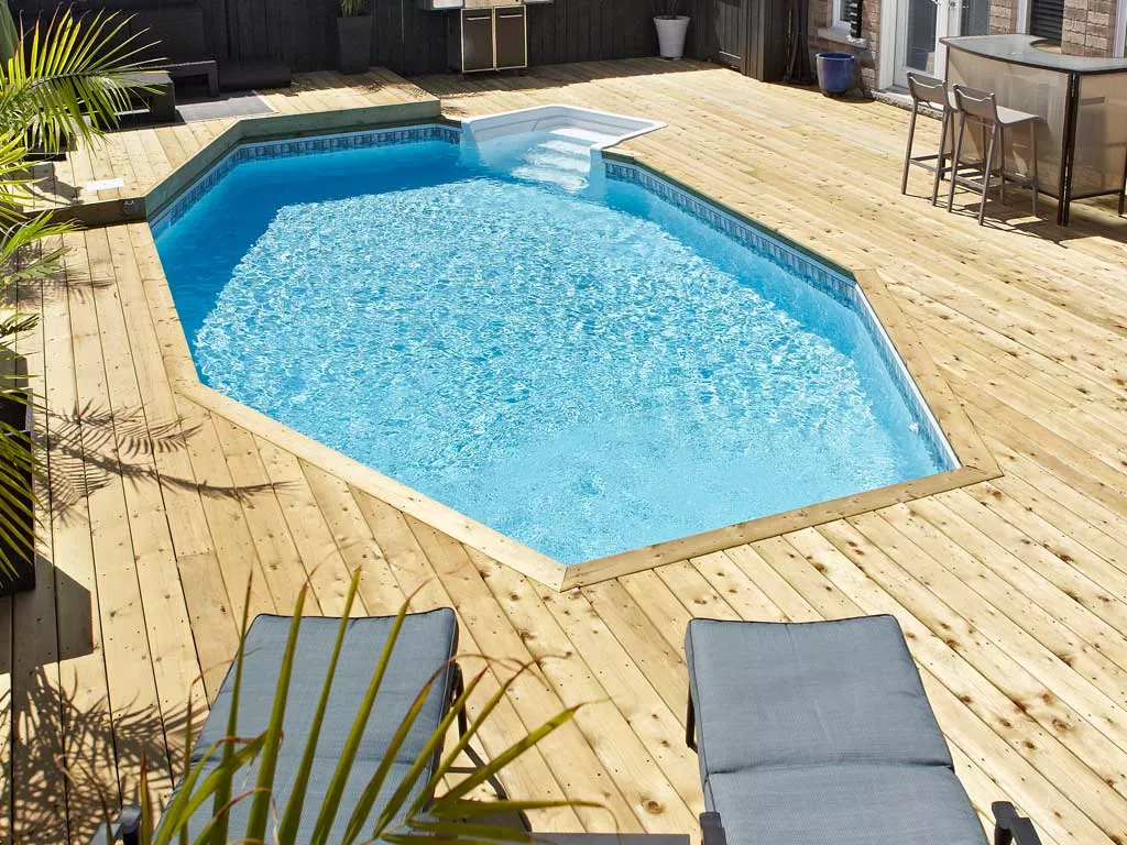 Large inground pool with stone surround