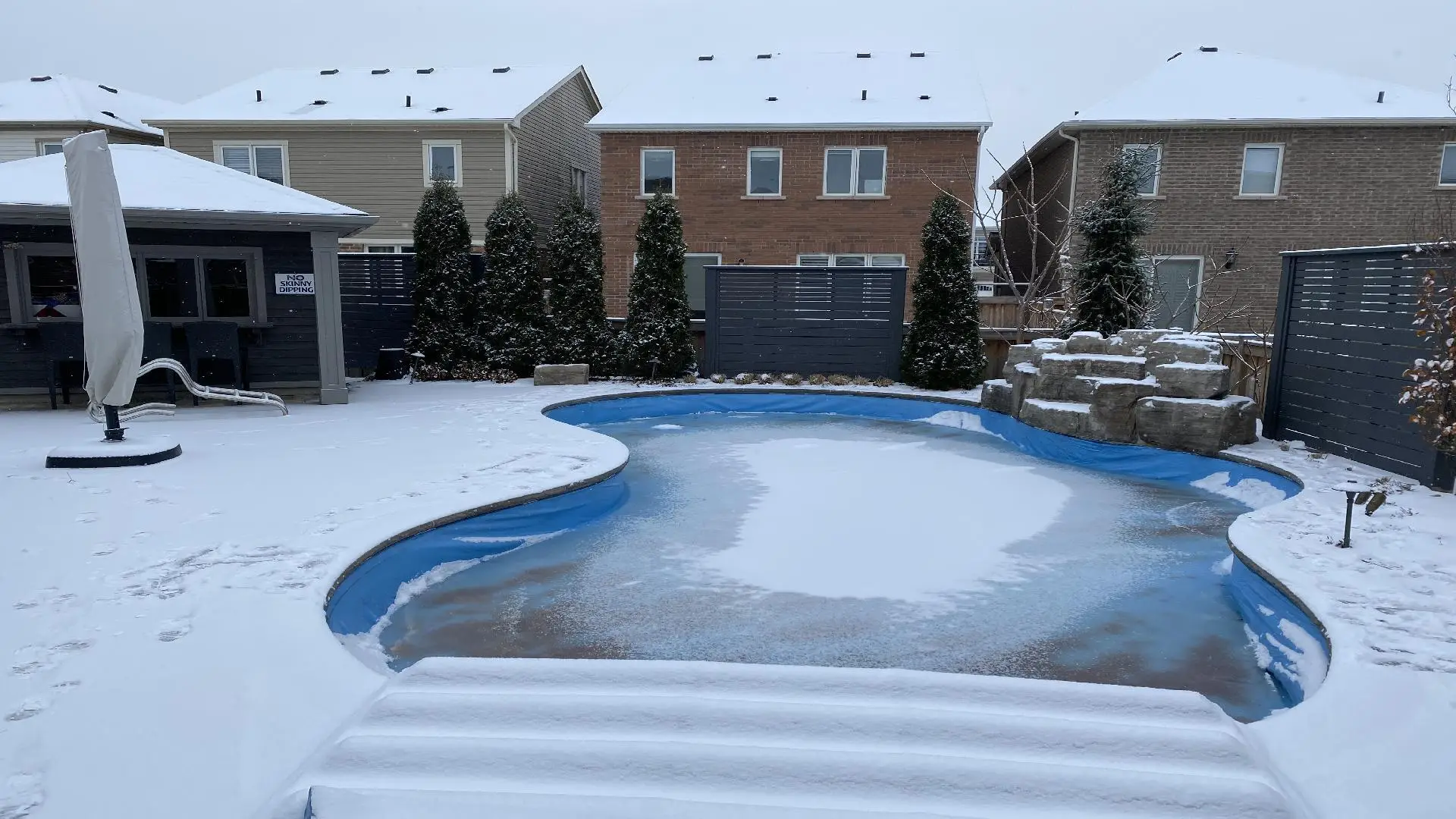 A pool secured with a lock-in winter cover