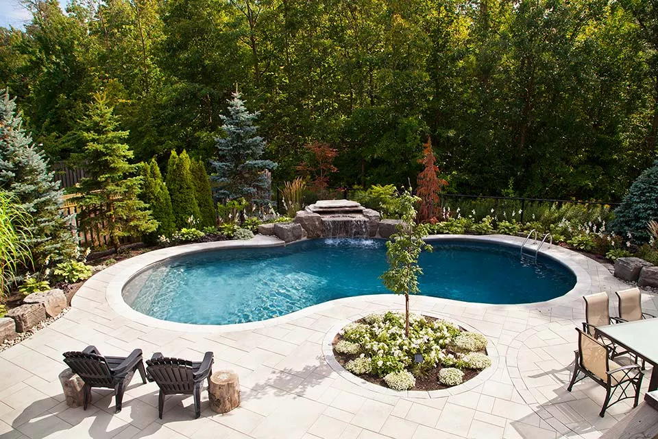 Pool with water feature at night