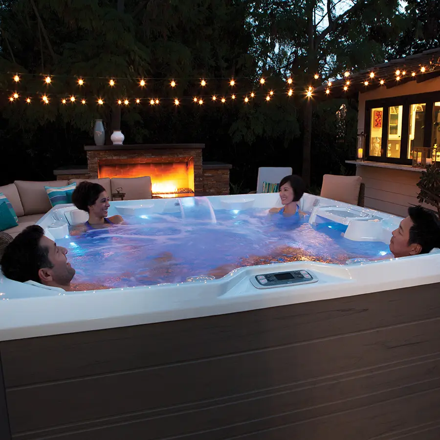 Adults in a HotSpring Limelight Pulse at night