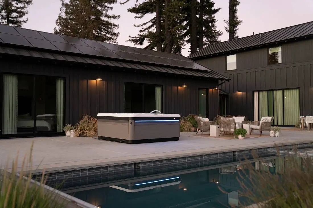 Luxury outdoor hot tub on a deck at twilight
