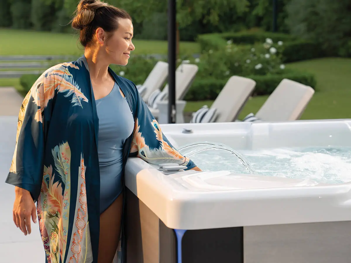 Woman testing FreshWater IQ hot tub water