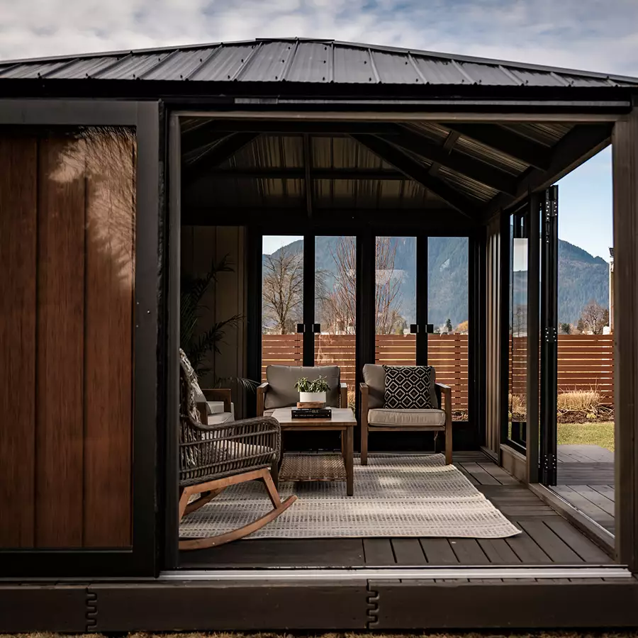 Wooden gazebo with decorative roof in a backyard